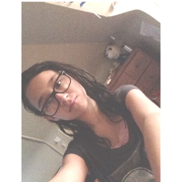 selfie of me in 2014 at a slight angle with a white border and a hazy filter