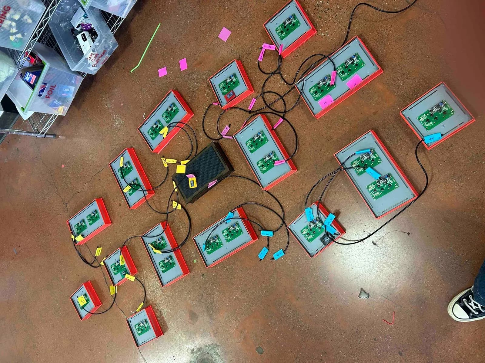 boxes face down on floor with loose wires